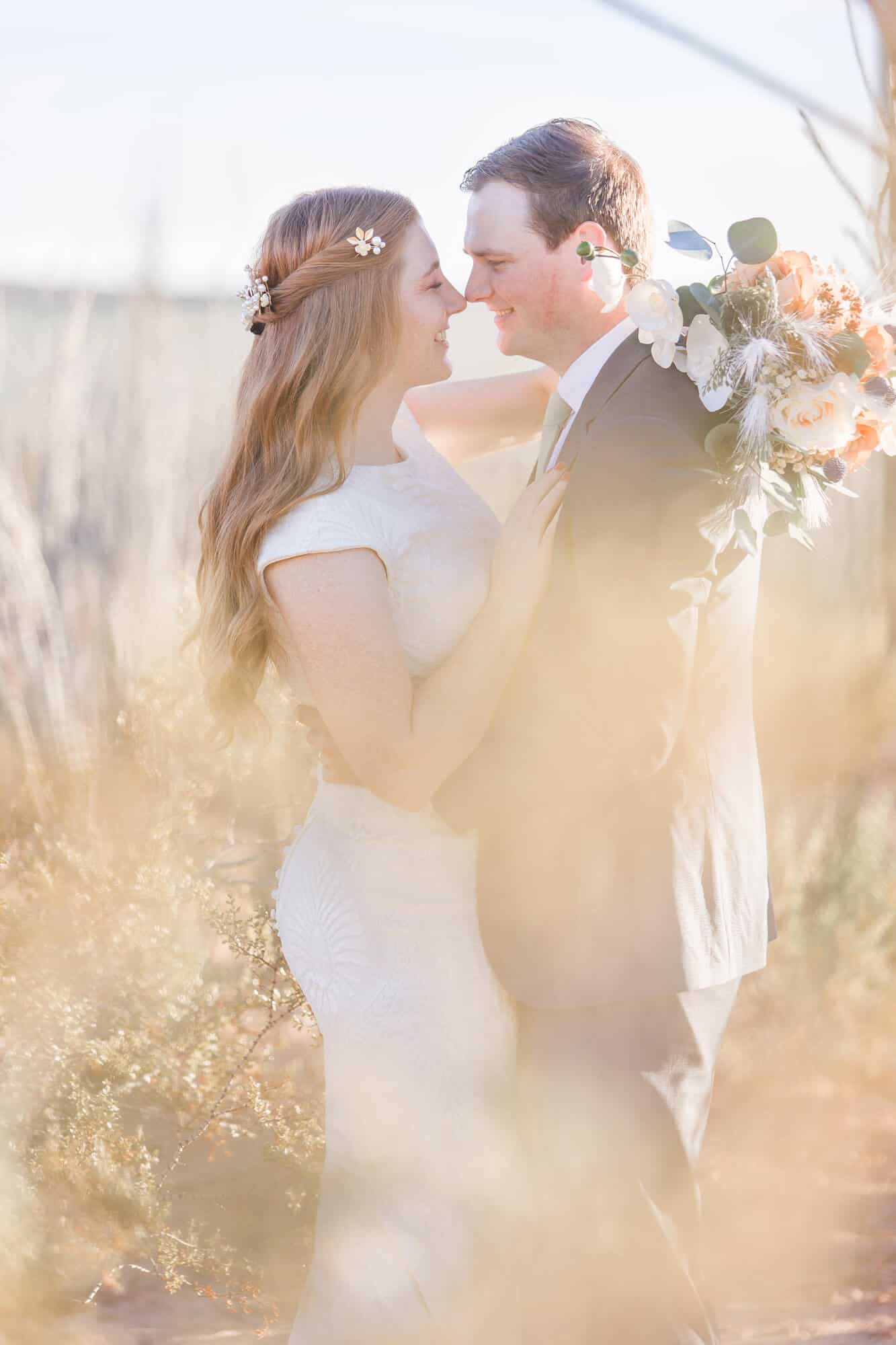 Newlyweds dance close before at sunset in the kiss cactus joe's wedding venue garden