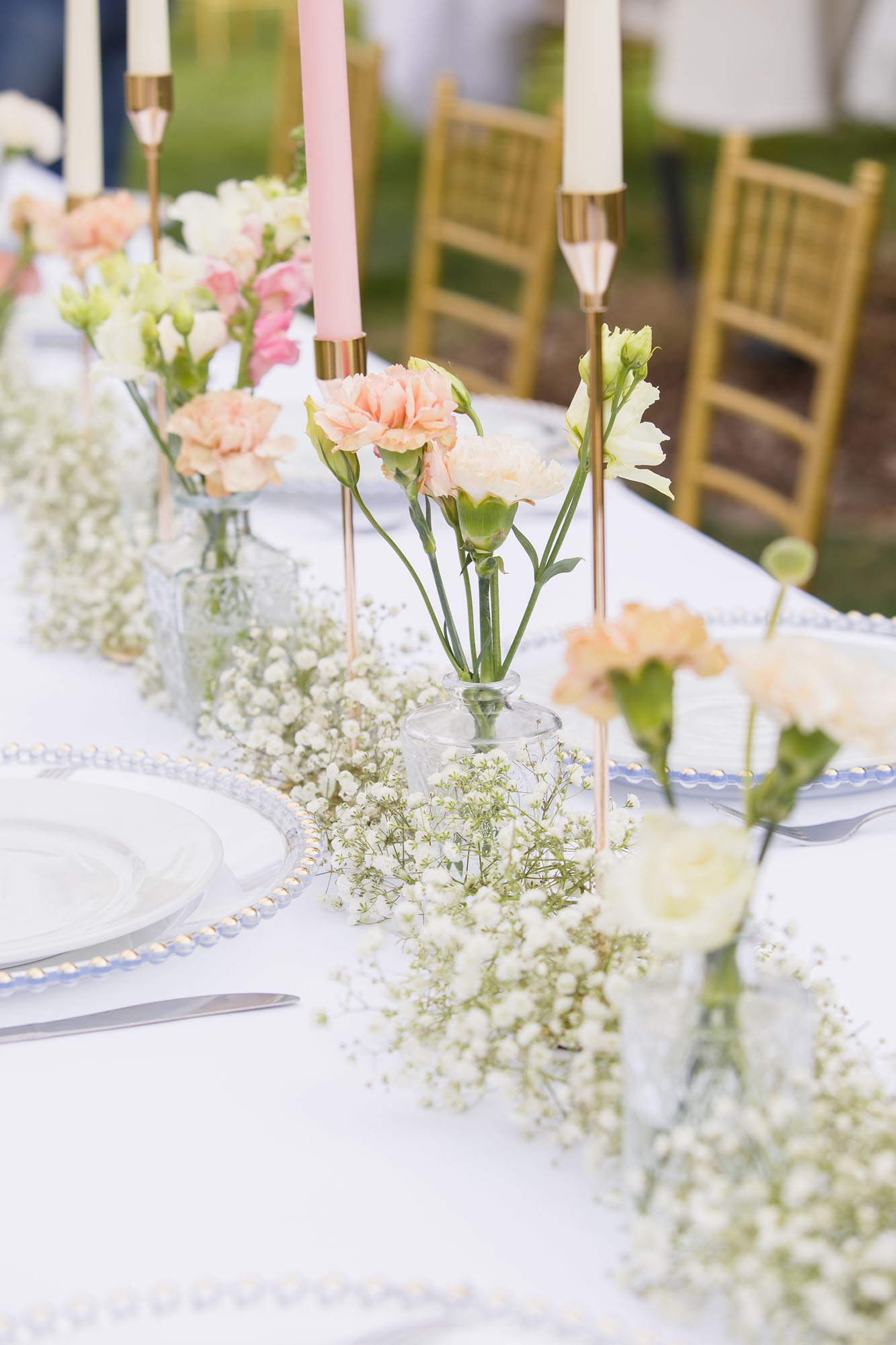 Details of a wedding reception table set up with carnations